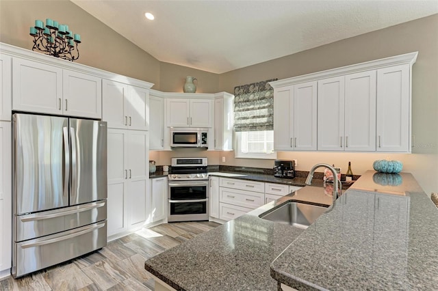 kitchen with white cabinets, sink, and stainless steel appliances