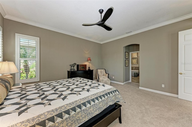 carpeted bedroom featuring ceiling fan and ornamental molding