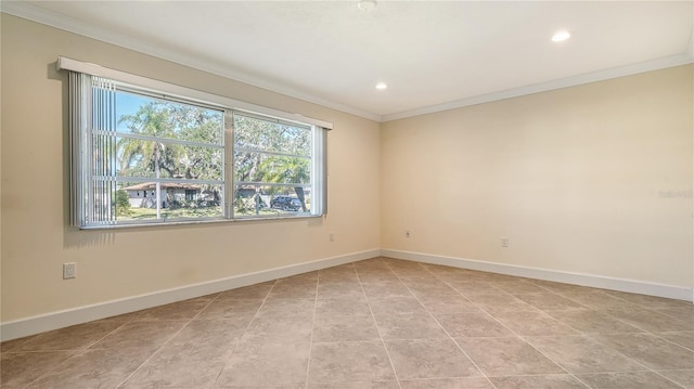 spare room featuring crown molding