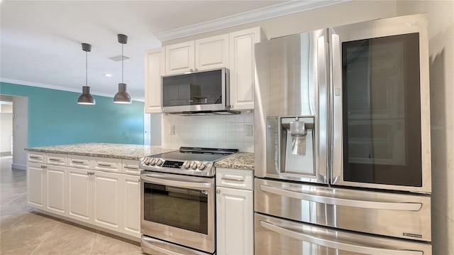 kitchen featuring light stone countertops, stainless steel appliances, and white cabinetry