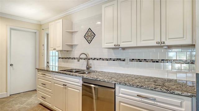 kitchen with light stone counters, sink, dishwasher, white cabinetry, and light tile patterned flooring