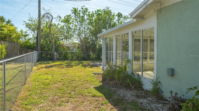 view of yard featuring a sunroom