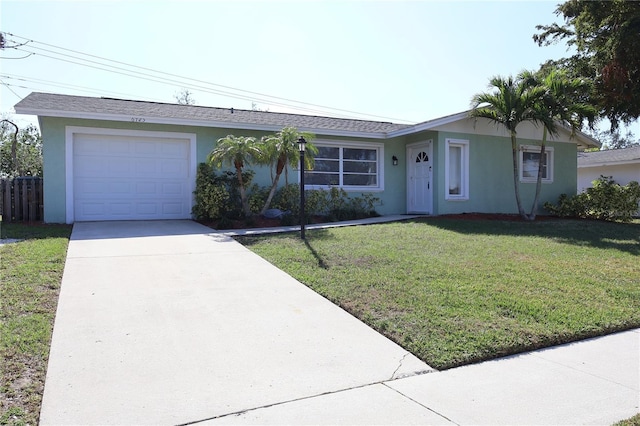 single story home with a garage and a front yard