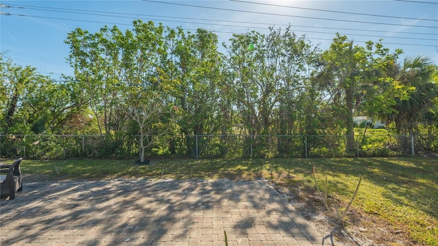 view of yard with fence and a patio