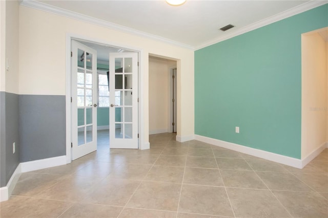 empty room featuring baseboards, visible vents, ornamental molding, french doors, and light tile patterned flooring