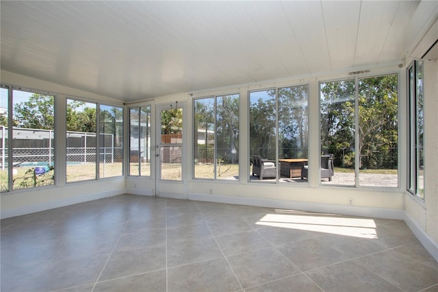 unfurnished sunroom featuring a healthy amount of sunlight