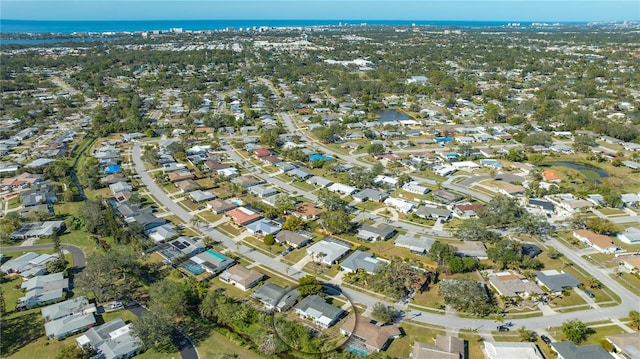 birds eye view of property featuring a water view and a residential view