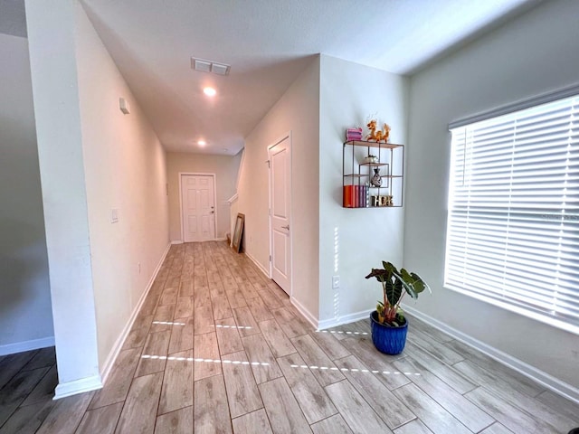 corridor featuring light hardwood / wood-style flooring