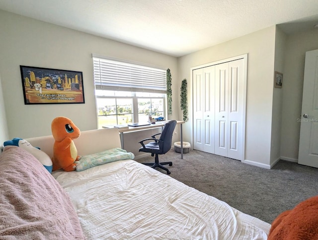 bedroom featuring a closet and carpet floors