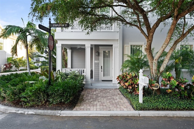 property entrance featuring a porch