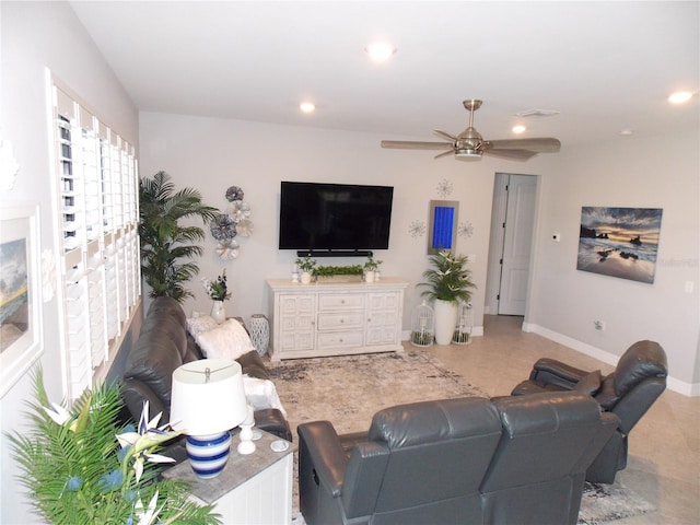 tiled living room with ceiling fan