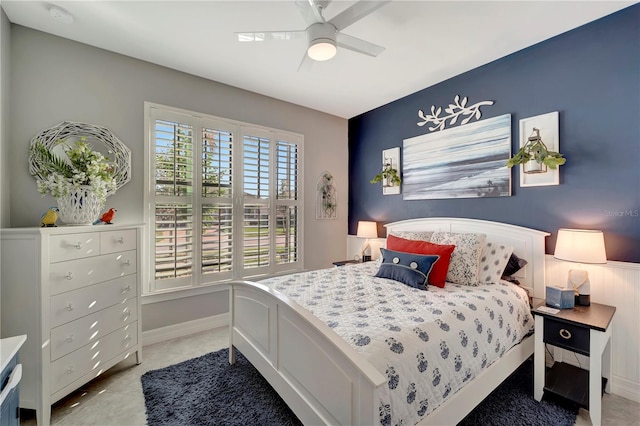 tiled bedroom featuring ceiling fan