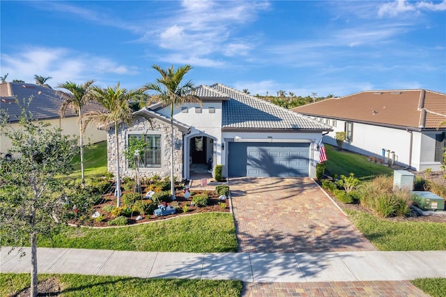 view of front of house featuring a garage and a front yard