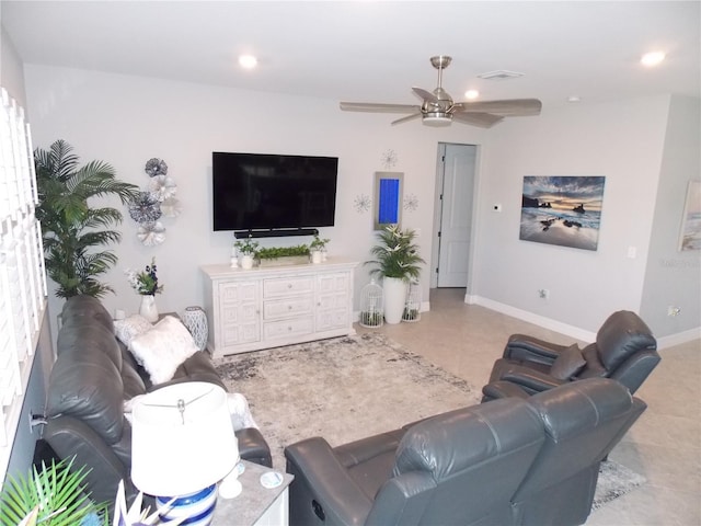 tiled living room featuring ceiling fan