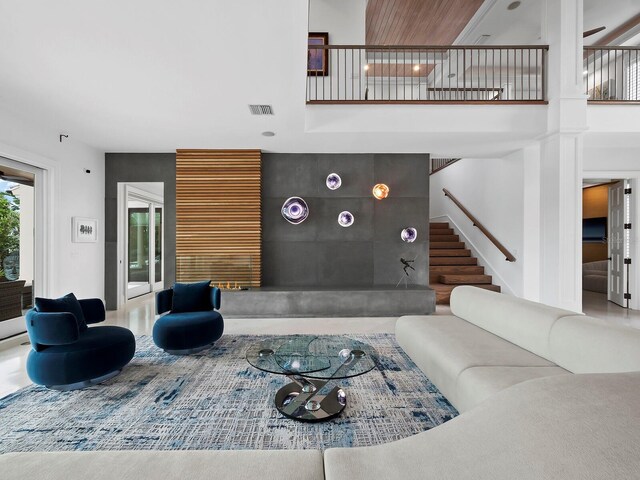 living room with a high ceiling