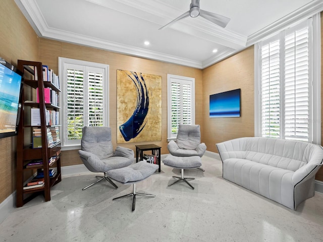 sitting room featuring ceiling fan, a healthy amount of sunlight, and crown molding