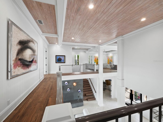 hallway with beam ceiling, ornamental molding, wooden ceiling, and wood-type flooring