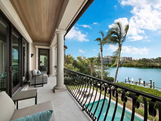 balcony featuring a water view