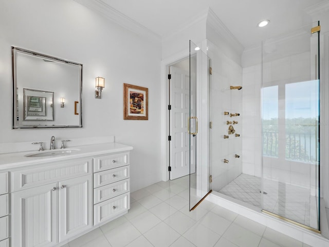 bathroom featuring tile patterned flooring, a shower with door, vanity, and ornamental molding