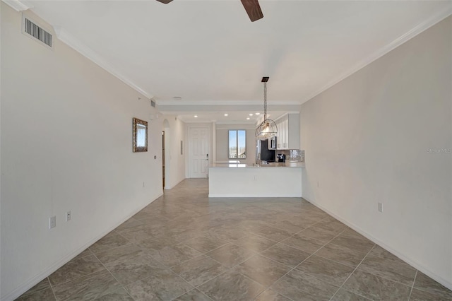 unfurnished living room featuring tile patterned flooring, ceiling fan, and crown molding