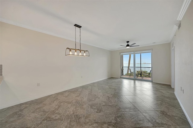 spare room featuring ceiling fan and crown molding