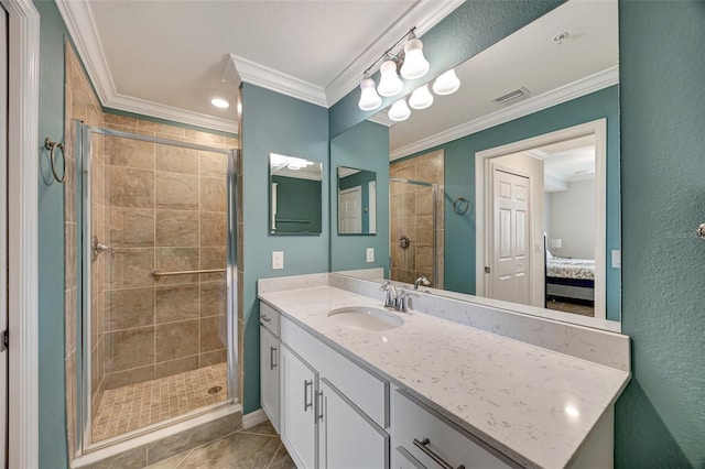 bathroom featuring tile patterned flooring, vanity, a shower with shower door, and ornamental molding