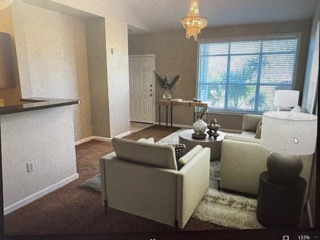 living room with plenty of natural light and a chandelier