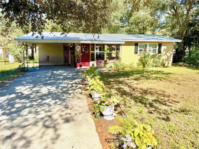 ranch-style house with a front lawn and a carport