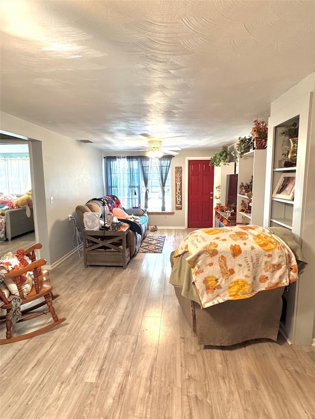 bedroom featuring ceiling fan and light hardwood / wood-style floors