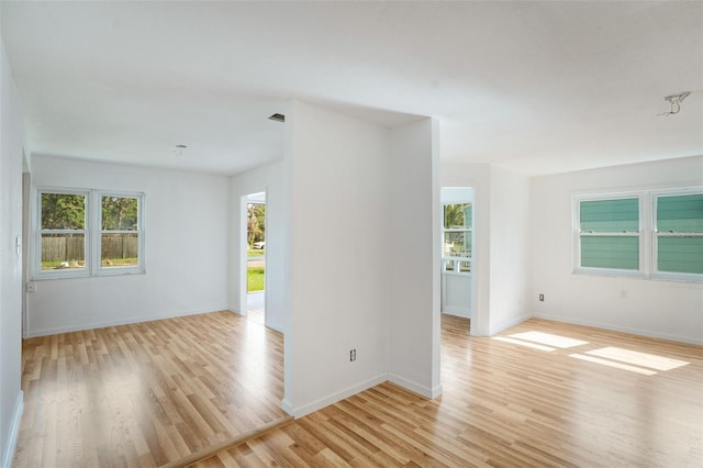 spare room featuring light wood-type flooring