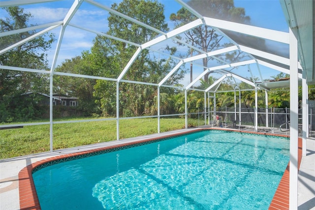 view of pool featuring a lanai and a yard