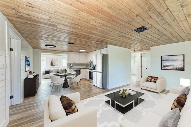 living room featuring light hardwood / wood-style floors and wooden ceiling