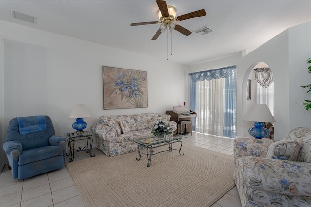 living room featuring ceiling fan and light tile patterned floors