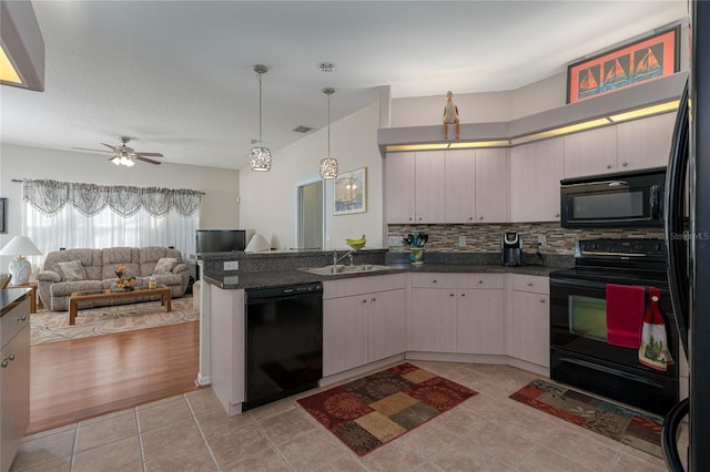 kitchen with decorative backsplash, ceiling fan, sink, black appliances, and decorative light fixtures