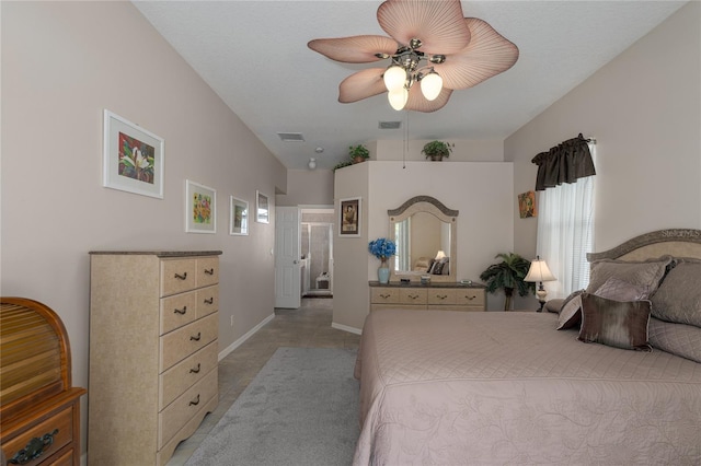 bedroom featuring ceiling fan and ensuite bathroom