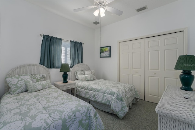 carpeted bedroom featuring a closet and ceiling fan