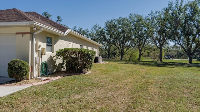 4569 35th Avenue Cir E, Palmetto, FL 34221 - view of grassy yard featuring an attached garage