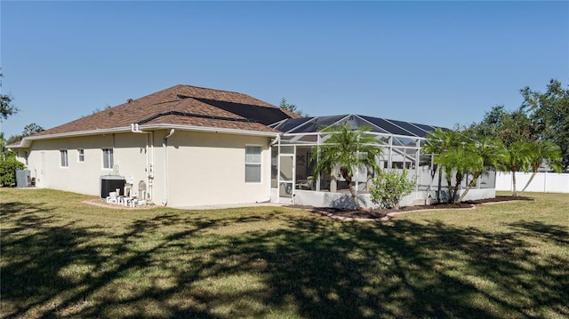 4569 35th Avenue Cir E, Palmetto, FL 34221 - rear view of house with stucco siding, central air condition unit, and a lanai