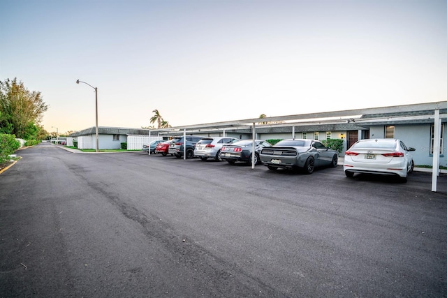 view of parking at dusk