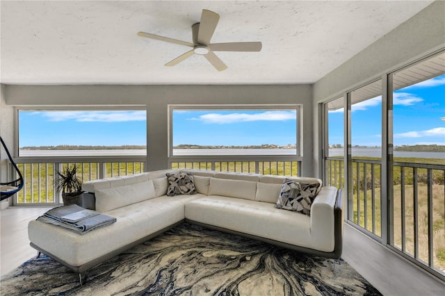 sunroom / solarium with ceiling fan