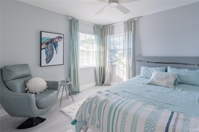 bedroom featuring ceiling fan and light hardwood / wood-style floors