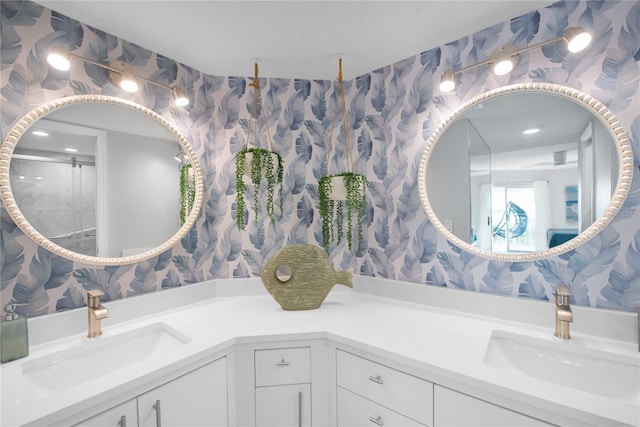 bathroom with vanity and a shower