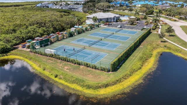 birds eye view of property with a water view