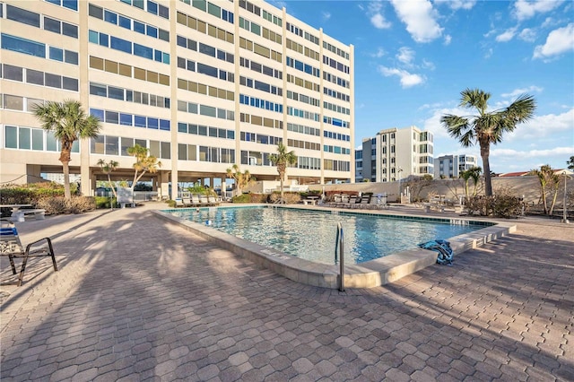 view of swimming pool with a patio area