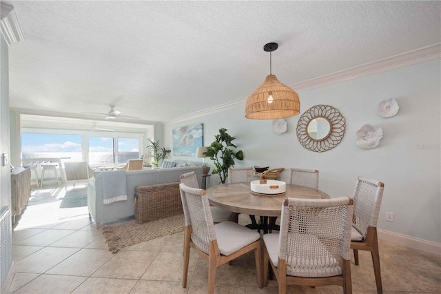 6140 Midnight Pass Rd Unit 407, Sarasota, FL 34242 - dining room featuring ceiling fan, light tile patterned floors, crown molding, and a textured ceiling