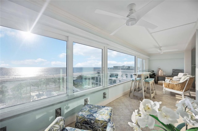 6140 Midnight Pass Rd Unit 407, Sarasota, FL 34242 - sunroom with ceiling fan, a healthy amount of sunlight, and a water view