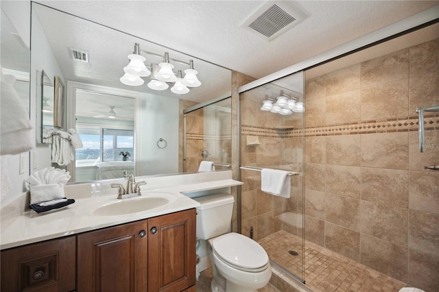 6140 Midnight Pass Rd Unit 407, Sarasota, FL 34242 - bathroom featuring a textured ceiling, a shower with door, vanity, toilet, and ceiling fan