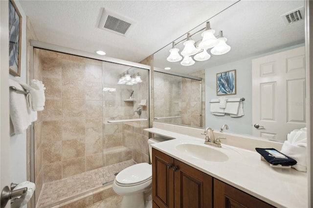 6140 Midnight Pass Rd Unit 407, Sarasota, FL 34242 - bathroom featuring toilet, a shower with door, tile patterned floors, a textured ceiling, and vanity