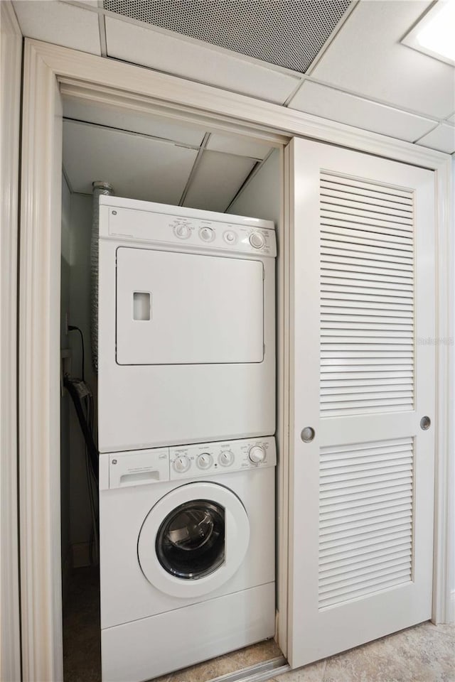 6140 Midnight Pass Rd Unit 407, Sarasota, FL 34242 - washroom with stacked washing maching and dryer