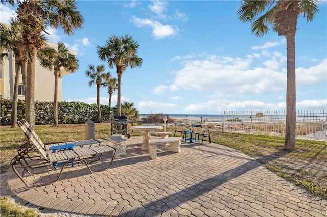 6140 Midnight Pass Rd Unit 407, Sarasota, FL 34242 - view of patio / terrace with area for grilling and a water view